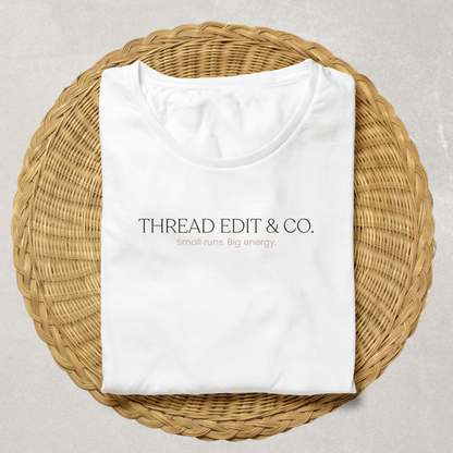 Folded white custom t-shirt with 'THREAD EDIT & CO. Small runs. Big energy.' text, part of Secure Tee Deposit - Custom Design | Quick Mockup, 48hr Proof.
